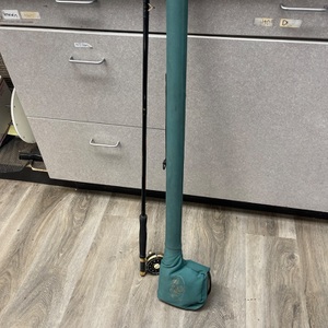 fly fishing rod and reel in green case